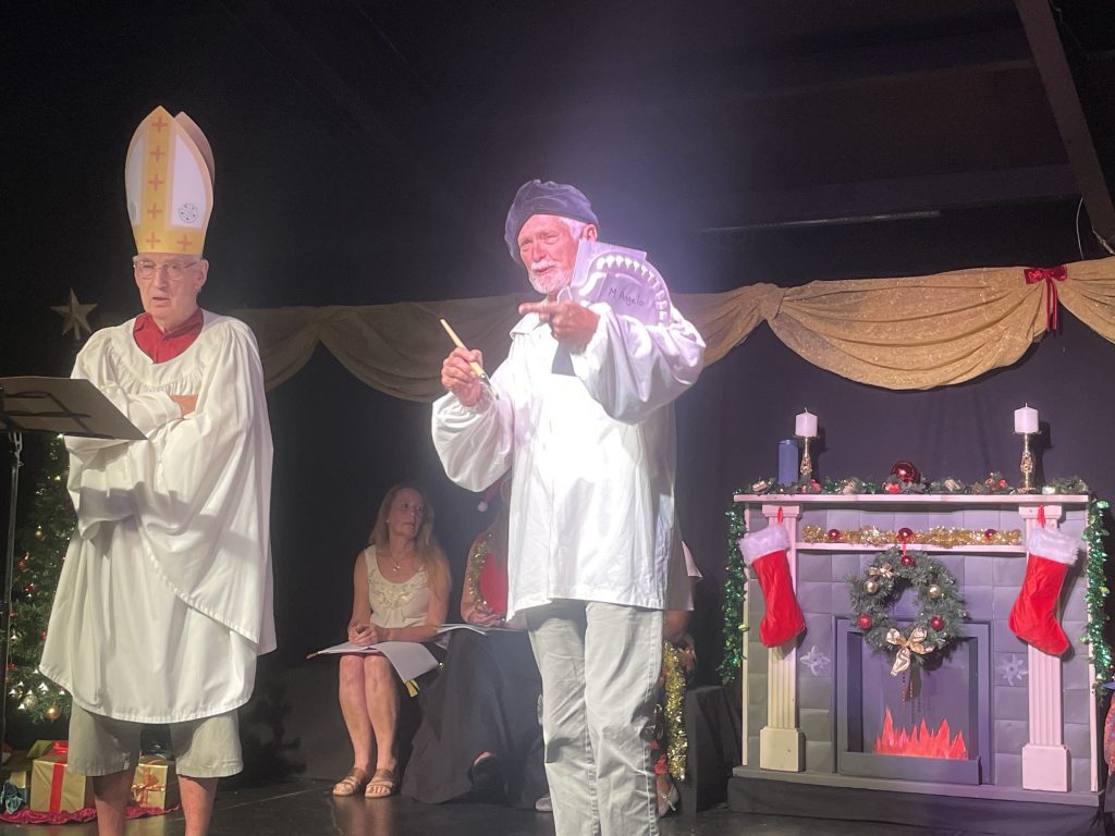 The Pope and Michelangelo (Tony Nettleton and Peter Segrove) squabbling over details of The Last Supper.