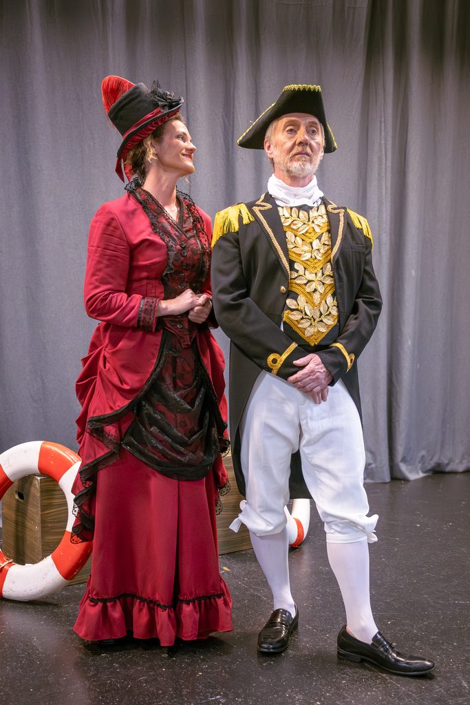 The Admiral (Dan Moore) and Sarah Munnik as Cousin Hebe – both in costumes (Hebe’s dress and the Admiral’s hat) made by Liesl.
